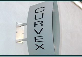 Curvex projecting sign