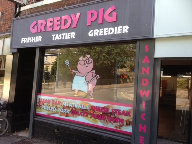 The Greedy Pig sandwich shop sign