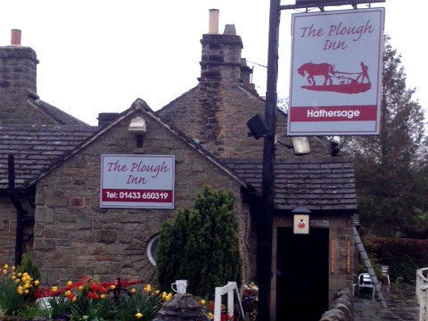Pub signs for The Plough at Hathersage